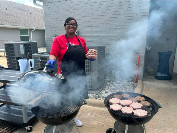 Staff Grilling at Community Cookout